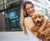 Woman deciding if pet insurance is worth the cost